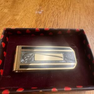 hinged gold-finish money clip features elegant marbled black and grey lacquer